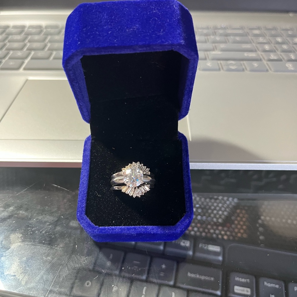 2ct Cz Round Solitare, with enhancer. 
 Size 6, pictures do not do it justice